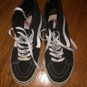 Black slightly worn high top vans